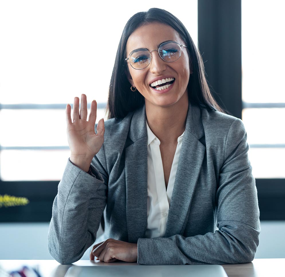 A woman providing eye contact during an online meeting.