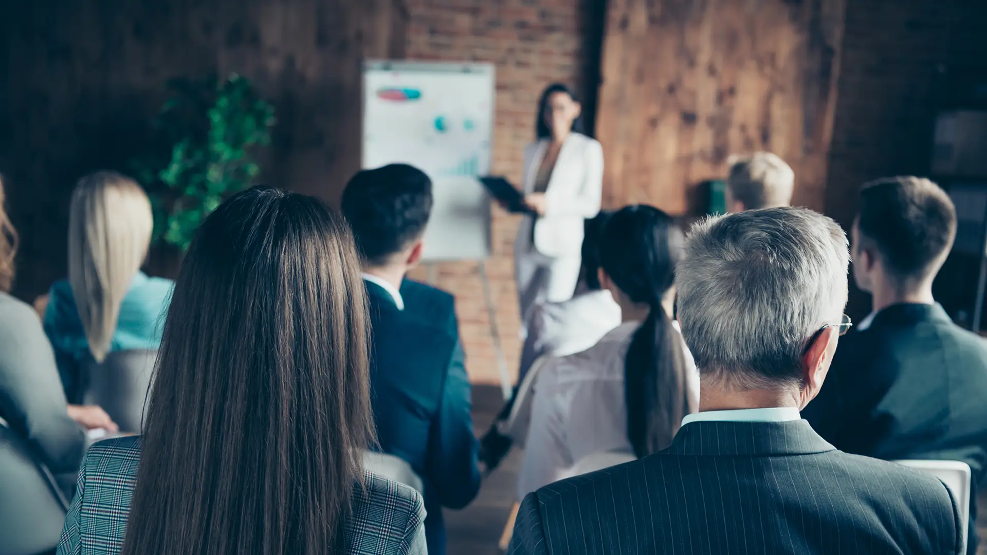 Business professionals attending a workplace training presentation