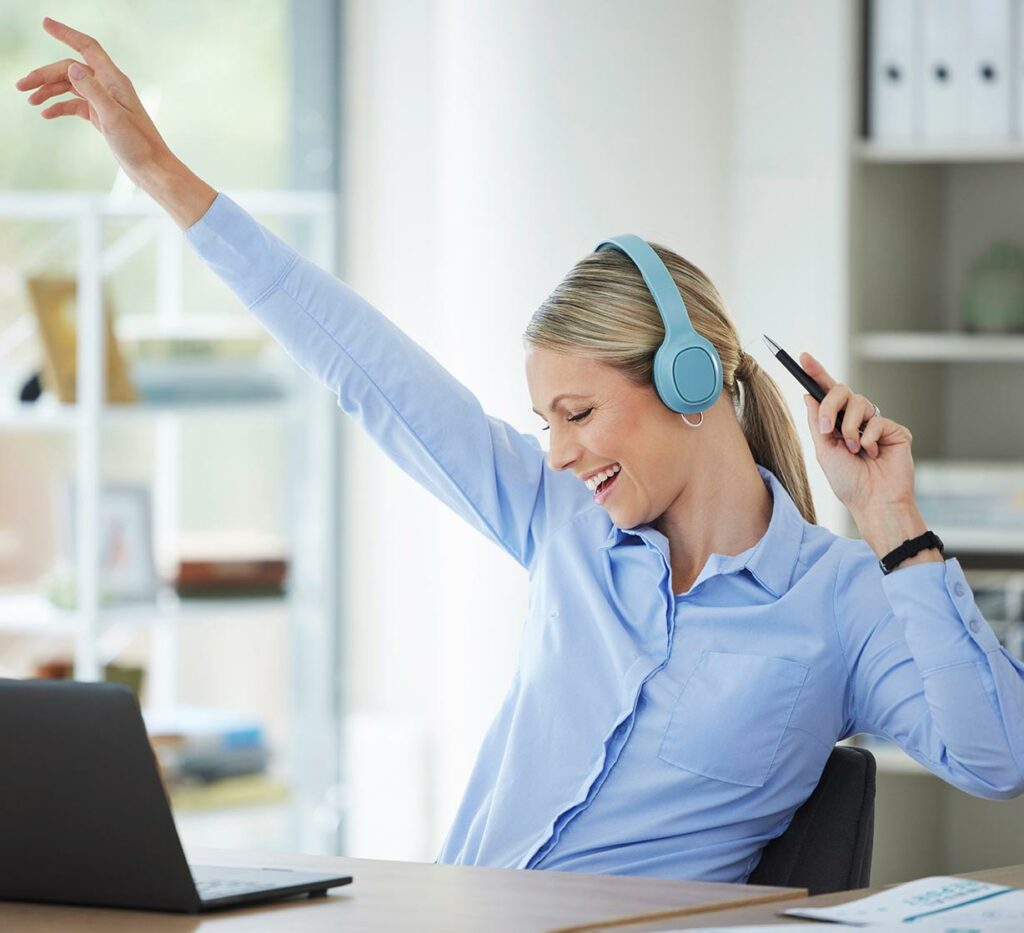 Business woman cheering during virtual meeting
